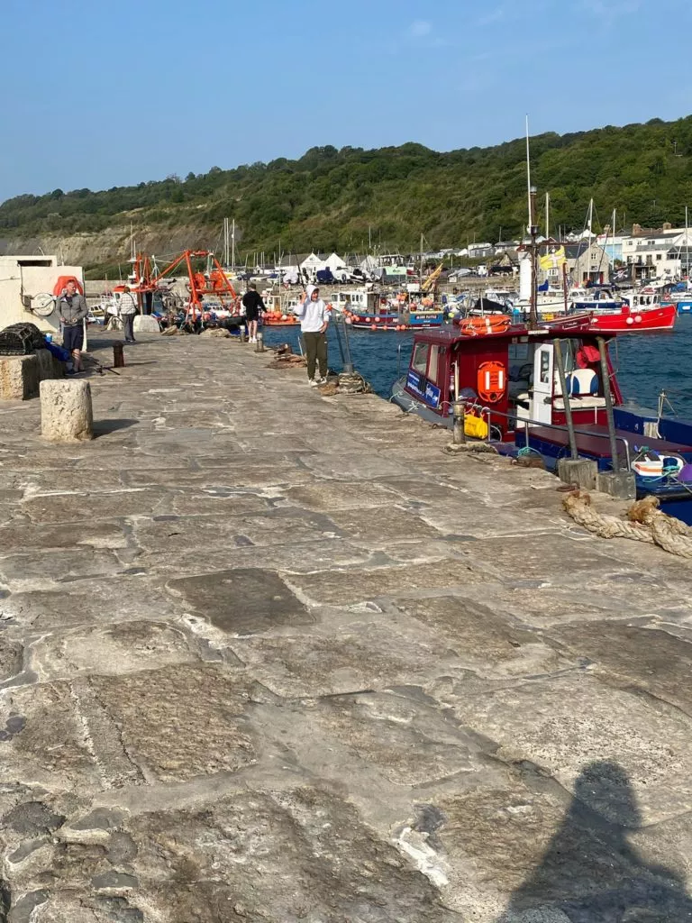 lyme regis cobb fishing boats on the coast