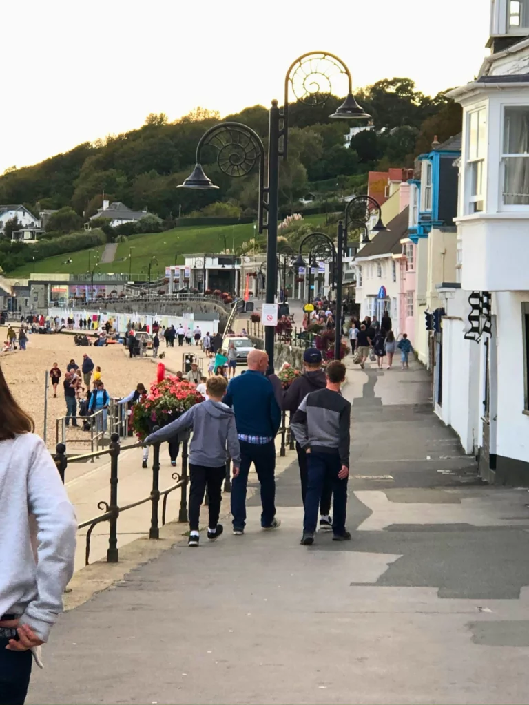 walking along the street at lyme regis beach