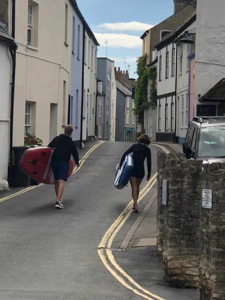 walking paddle boards from lym house to lyme regis beach