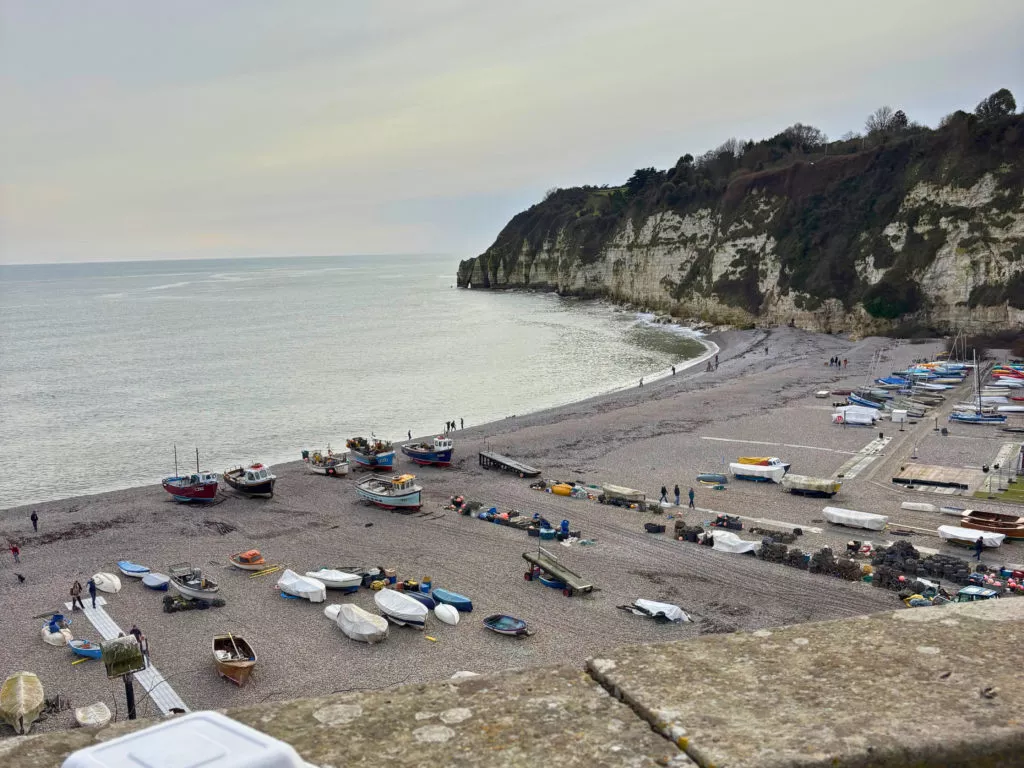 Beer beach and cliffs in Devon. working fishing village with boats on the beach
